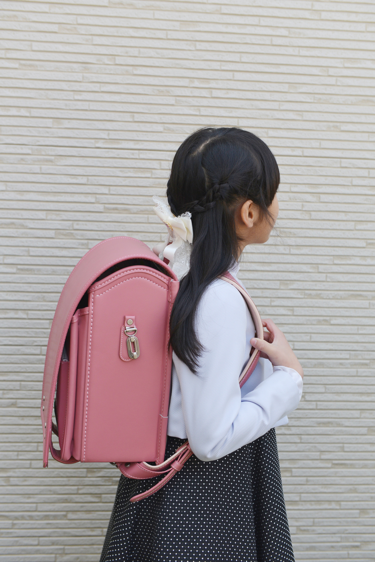 Japanese girl heading to elementary school entrance ceremony